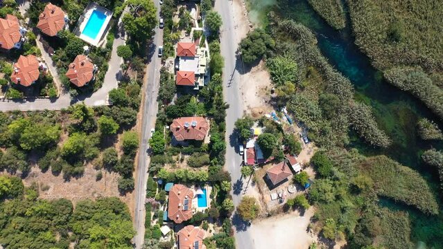 Akyaka Resort Town with the Azmak River in Mugla Turkey. In addition to the long, sandy beach in Akyaka, hotels and pensions with nature views are lined up along the Azmak river
