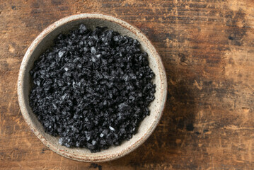Black Lava Salt in a Bowl - 628333183