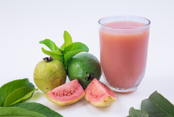 Guava juice and fresh red guava  with green leaves on a white background