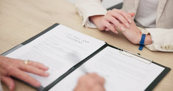 Document, signature and hands of a lawyer with a client for a will, planning death or agreement. Office, attorney and a legal employee writing on paperwork for a person in a law negotiation together