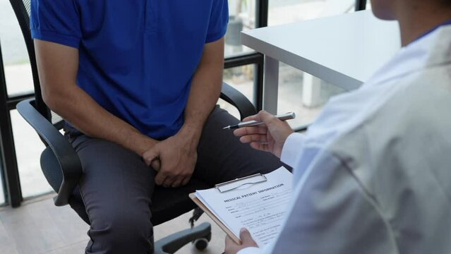 female doctor and testicular cancer patient are discussing about testicular cancer test report. Testicular cancer and prostate cancer concept.