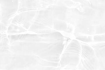 Obraz premium White water with ripples on the surface. Defocus blurred transparent white colored clear calm water surface texture with splashes and bubbles. Water waves with shining pattern texture background.