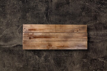 Wooden kitchen chopping board on stone desk
