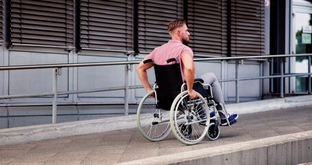 Man With Physical Disability In Wheel Chair
