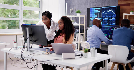 African Financial Data Analysts Using Dashboard On Screens