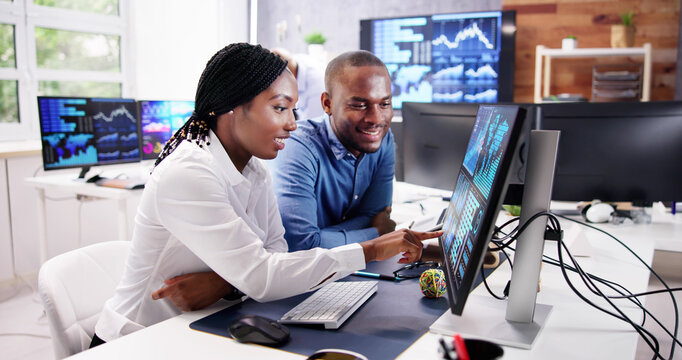 African Financial Data Analysts Using Dashboard On Screens