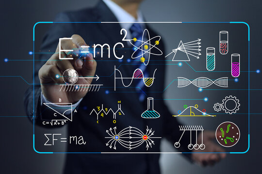 A scientist or university professor of science is using a virtual chalkboard to teach or study energy and speed of light, magnetic field direction, chemical reactions and microscopic organisms.