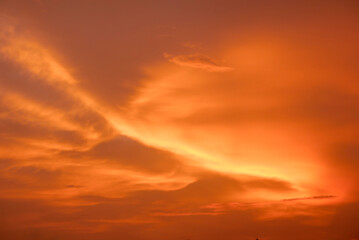 The sky at sunset is orange.