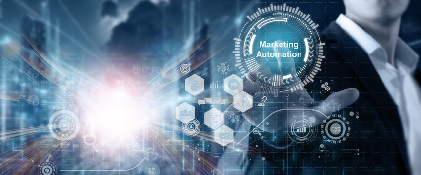 Marketing automation, growth marketing strategy concept. Digital marketing tools used for customer engagement. Businessman touching on screen with marketing automation text on digital background.