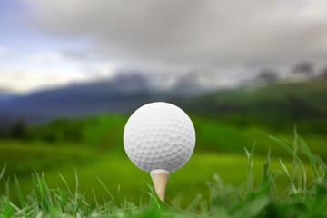 Golf balls on the green course with clubs, sport concept.