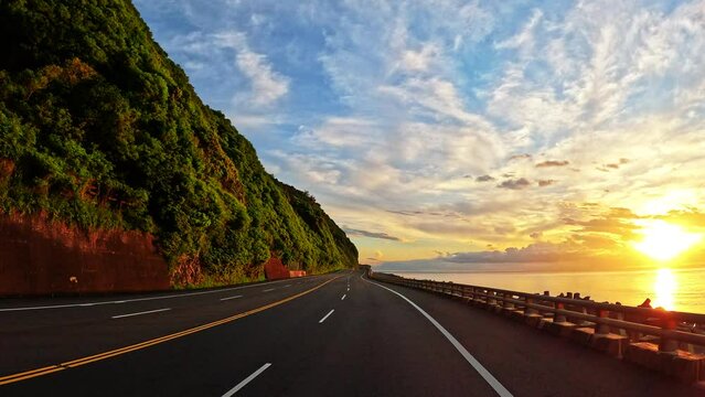 Driving into sunrise on south-link coast highway ,Taiwan.