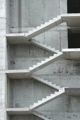 Stair flights and floors of the building at the construction stage. Vertical photo.