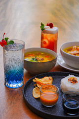 Drinks Ice Tea Blue and Grape Cocktail and Indonesian Food Soto Sambal