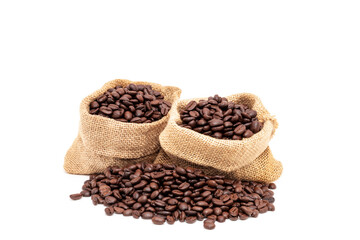 Heap of brown roasted coffee beans in burlap bags isolated on white background. fresh coffee beans concept