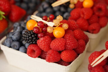 Fresh fruits - berries,  red berries, blueberries, blackberry, Redcurrant on food market