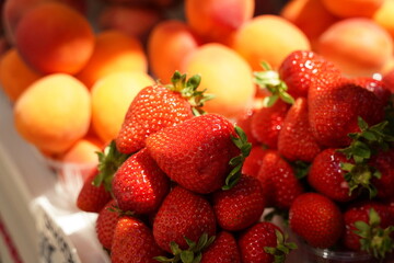 Fresh red strawberries in basket ready for sale at marketplace.