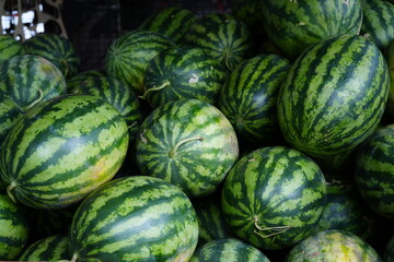 Watermelon fruits are sold in tropical countries.