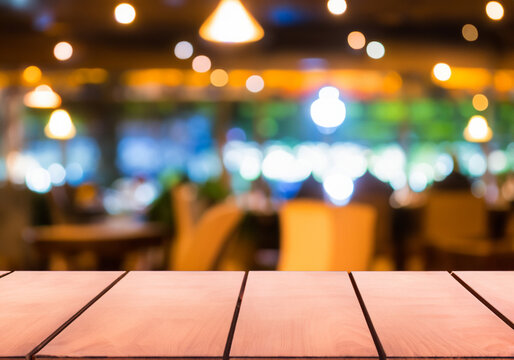image of wooden table In front of abstract blurred  background of resturant lights MADE OF AI