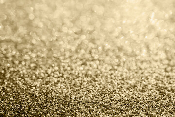 Abstract gold glitter sparkle blurred with bokeh background