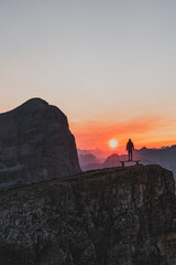 Silhouette of a person during a morning sunrise in the mountains of Italy