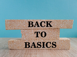 Back to basics symbol. Concept word Back to basics on brick blocks. Beautiful blue background. Wooden table. Business and Back to basics concept. Copy space