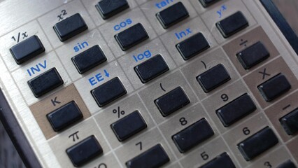 Accountant Using Retro Calculator Pencil Close-up
