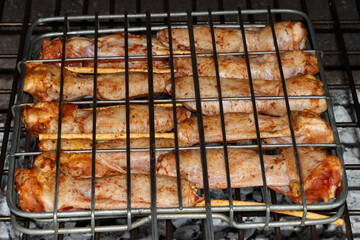 Barbecue - chicken wings over the coals