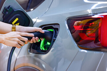 EV charging an electric car.Power supply for electric car charging. Socket for electric car battery...