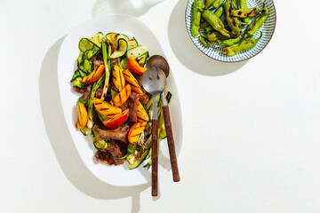 Warm grilled beef salad and seasonal vegetables. Top view, copy space.