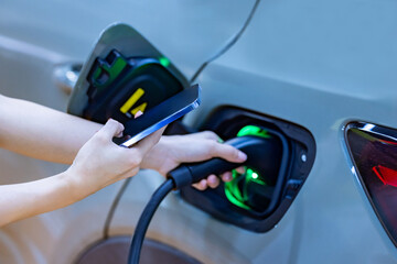 EV charging an electric car.Power supply for electric car charging. Socket for electric car battery...