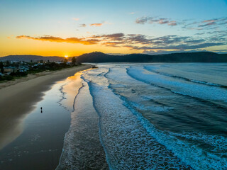 Sunrise at the seaside with gentle surf
