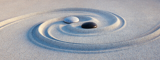 Yin Yang symbol. Motive made of stones and lines in the sand - 3D illustration - 628412782