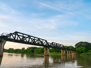 Fototapeta na wymiar .The train is passing through the Death Railway Bridge over the River Kwai in Kanchanaburi. .During World War Two Japan constructed railway from Thailand to Burma This is now know the Death Railway..