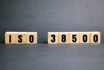 wooden cube with words and numbers ISO 38500. Corporate Governance of Information Technology
