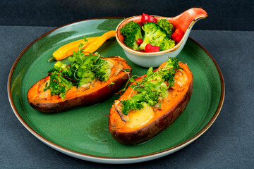 Baked sweet potato with vegetable filling.