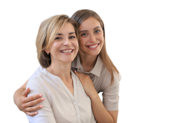 Beautiful middle aged mom and her adult daughter are hugging, looking at camera and smiling on a transparent background.