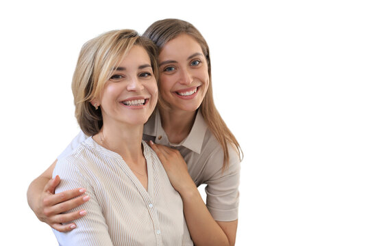 Beautiful middle aged mom and her adult daughter are hugging, looking at camera and smiling on a transparent background.