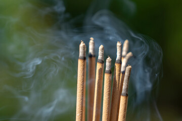 Incense stick burning with smoke