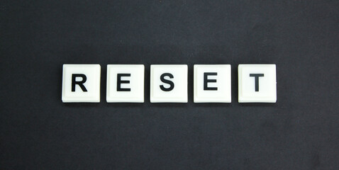 letters of the alphabet with the word reset. reset concept