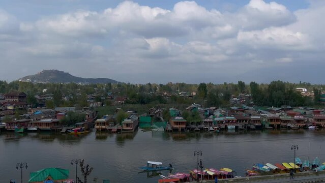 View of Dal Lake in summer, and the beautiful mountain range in the background in the city of Srinagar, Kashmir, India.
