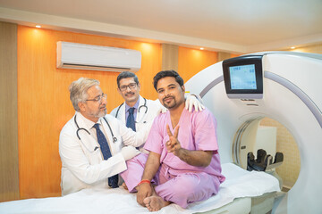 Medical technician discussing before MRI scan procedure of patient at clinic.