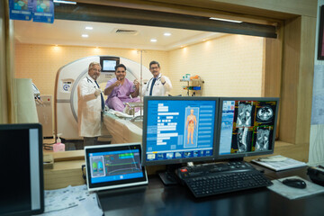 Doctor and patient showing thumps up after complete MRI.