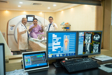 Doctor and patient showing thumps up after complete MRI.