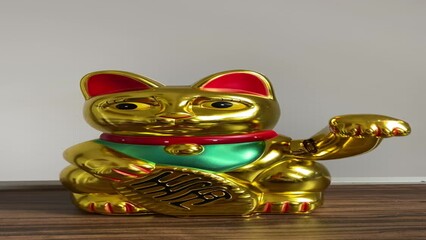 Japanese golden lucky cat statue with a hand bringing money and luck beckoning cat maneki-neko