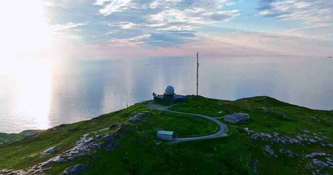 Drone shot circling the weather radar on top of Hillesoy, summer in north Norway