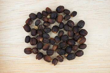 Dried Coffee fruit on wooden background