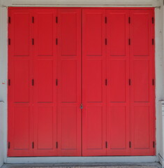 Fototapeta premium Large foldable doors closed with padlock