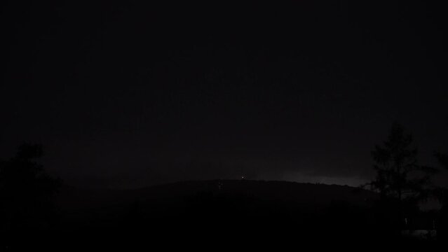 Heavy clouds bringing thunder, lightnings and storm. Thunderstorm flashes with multiple bolts of lightning. 