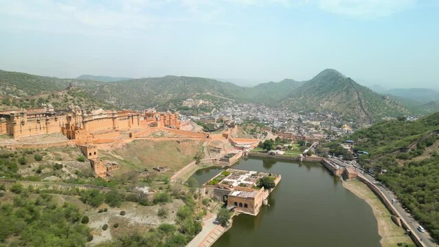 Jaipur, India: Aerial view of iconic fort Amber Palace, built from sandstone and marble - landscape panorama of South Asia from above