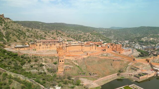 Jaipur, India: Aerial view of iconic fort Amber Palace, built from sandstone and marble - landscape panorama of South Asia from above
